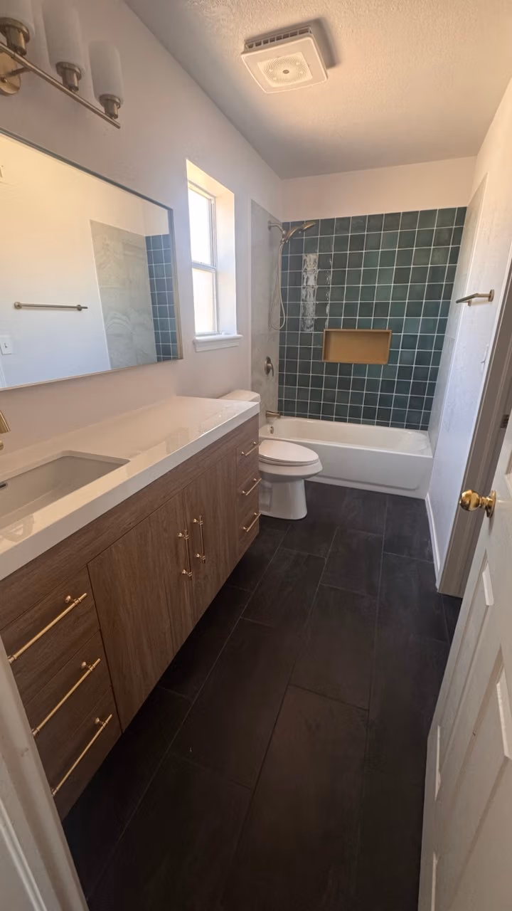 Coastal bathroom remodel full door view by Forged Builds El Paso TX