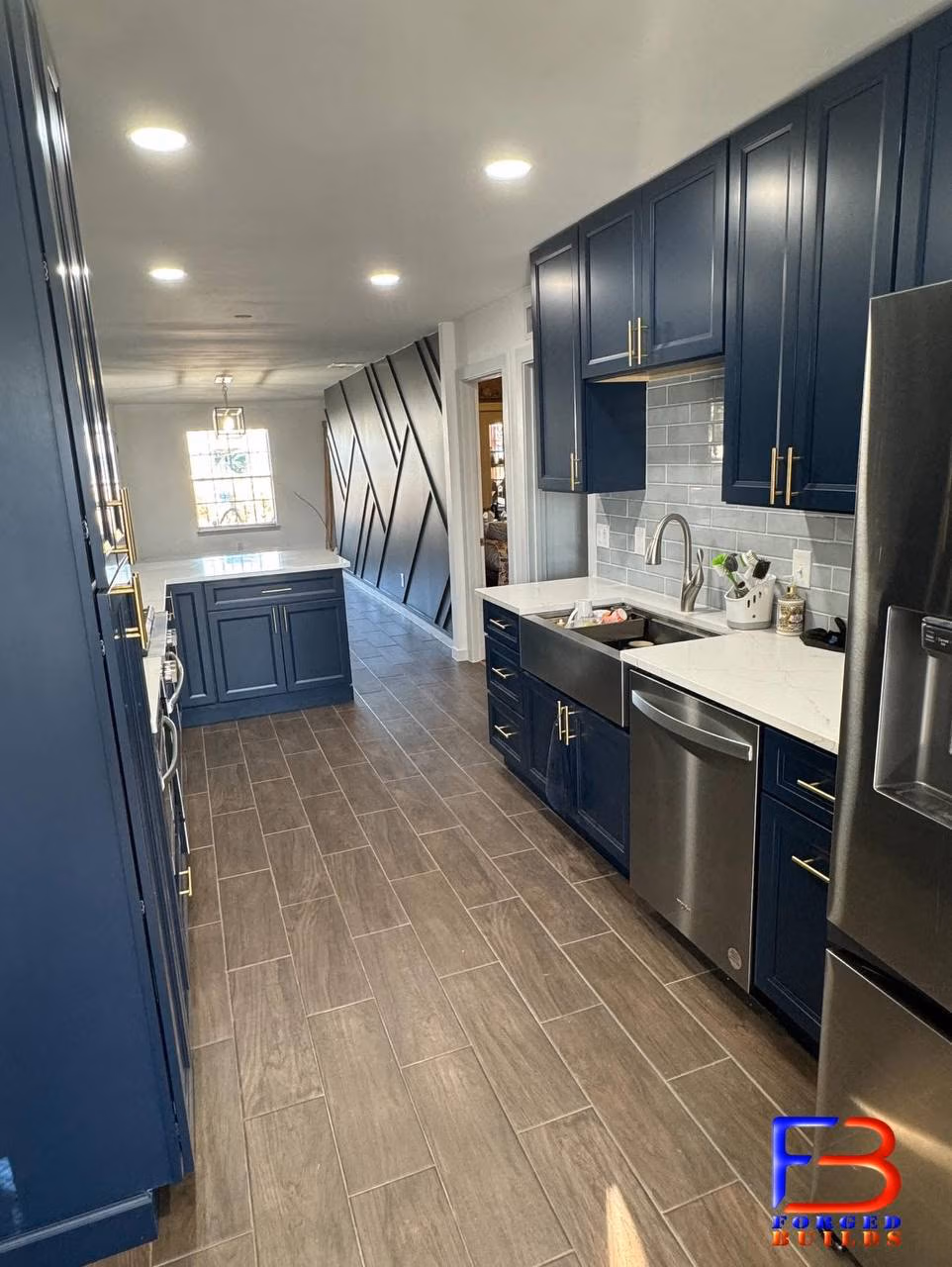 Full gut blue kitchen remodel wide sink view with Bayville Blue cabinets by Forged Builds El Paso